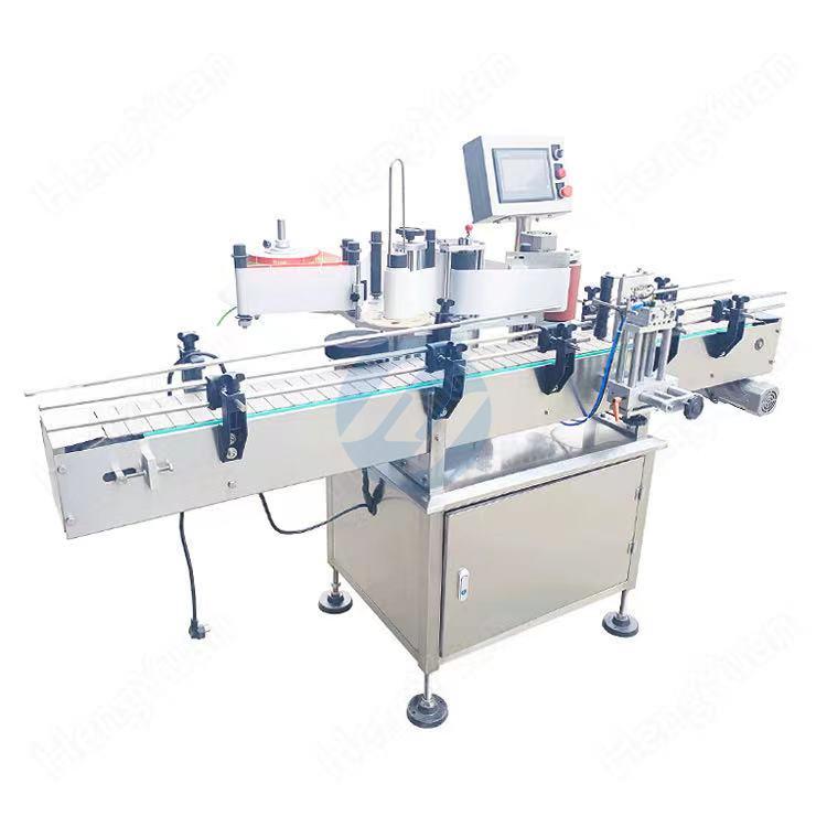 Automatic clamping round bottle sticker label applicator